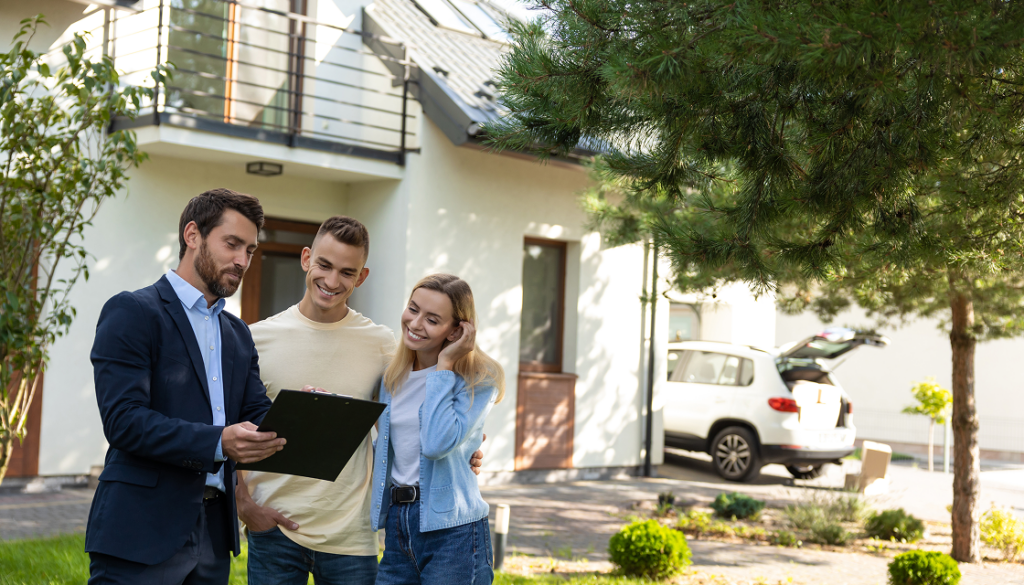 Couple viewing a house with agent