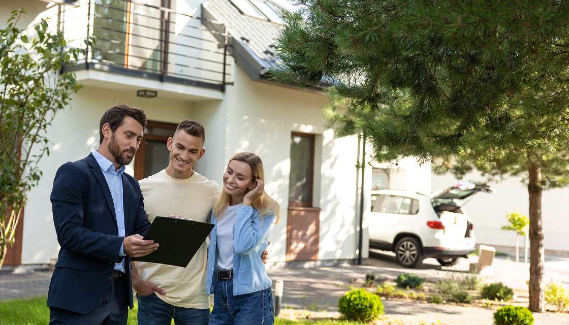 Couple viewing a house with agent